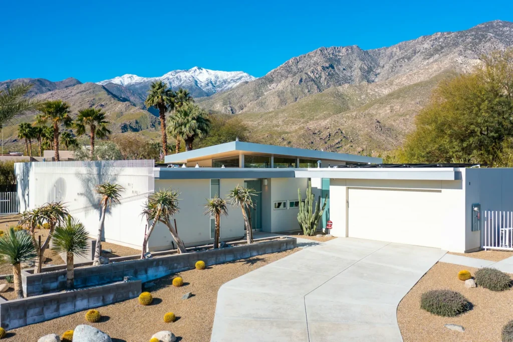 Desert home with mountains in the background.