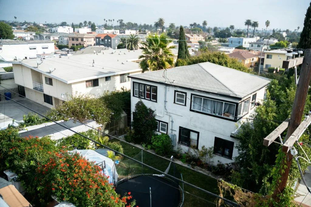 Aerial view of homes and city buildings.