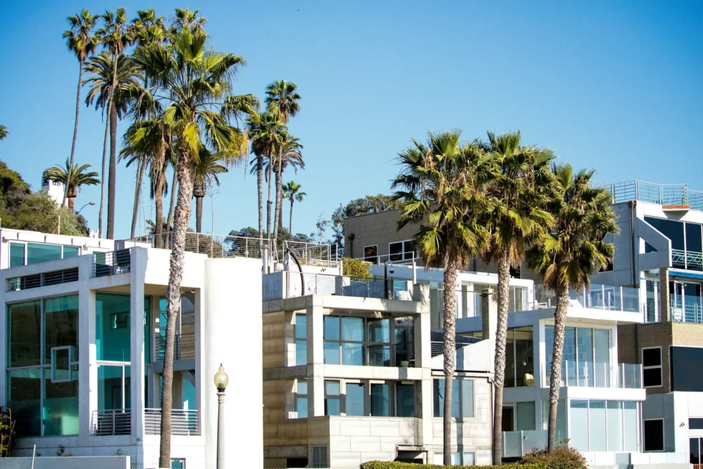 Palm trees and modern building exterior.